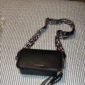 Stylish Black Crossbody Bag with Patterned Strap